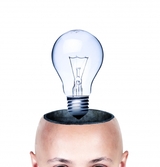 Topless bald head with a light bulb coming out of it. 