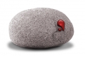 A round grey stone with a drop of blood coming out of it.